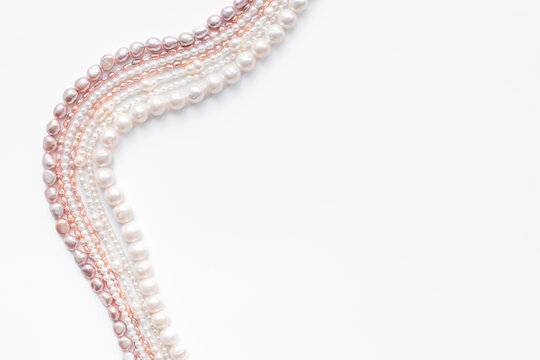 Precious pearls necklace beads for jewelry, top view. Different shapes pearls. Beauty and elegance concept background