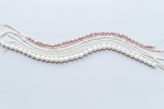 Natural baroque pearls beads - white, golden and purple - for jewelry, top view