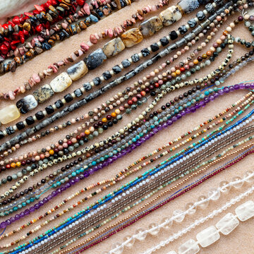 Lot of chains of gemstones and pearls beads for jewelry, top view