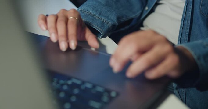 Close-up young Black female programmer coding AI software on multiple screens in night office. Network security, cybersecurity, machine learning, working late, overtime, robotics automation concept.