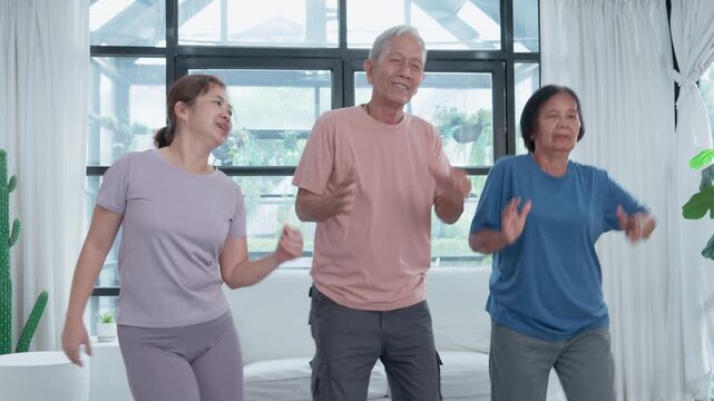 Joyful Group Exercise: A trio of active seniors, brimming with vitality, engages in a spirited exercise session at home. Embracing a wellness lifestyle through fun, fitness, and shared camaraderie.