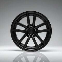 Obraz premium Sleek matte black multi-spoke alloy wheel, a clean, modern automotive accessory