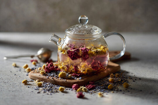cup of tea and teapot with flowers