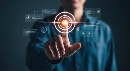 Fototapeta premium Businessman pointing at virtual target icon with digital interface.