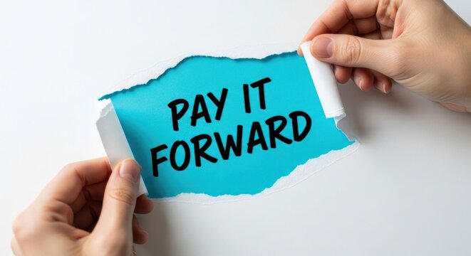 Hands Tearing Paper with Pay It Forward Message.