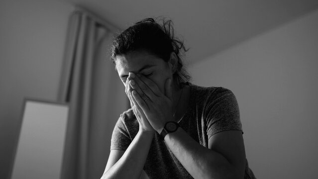 Exhausted woman covering face with hands in frustration and emotional distress at home, mental health struggle, depression, burnout, anxiety, overwhelmed feelings, sadness