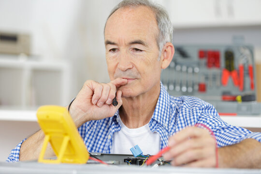 senior electrician thinking about something