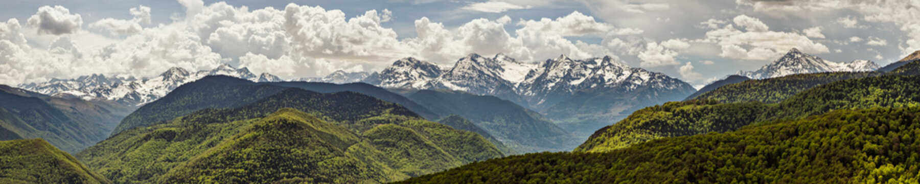 Panoramic view of the snow capped Pyrenees mountains in France viewed from the Col d'Aspin