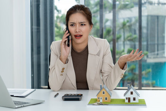 Frustrated Asian Female Real Estate Agent Arguing on Phone
