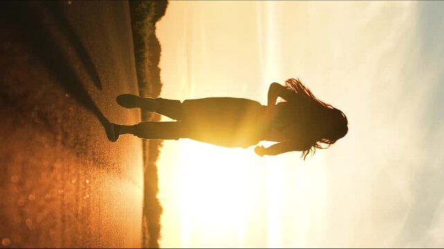 silhouette sports girl running legs along road sunset, woman runs, jogger, challenging yourself, runner training, female power, sport leisure fitness, fitness man checking result. beautiful woman