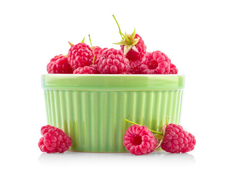 Fresh raspberries in the ceramic bowl. Natural oganic healthy food. ripe fruit, isolated on white background.
