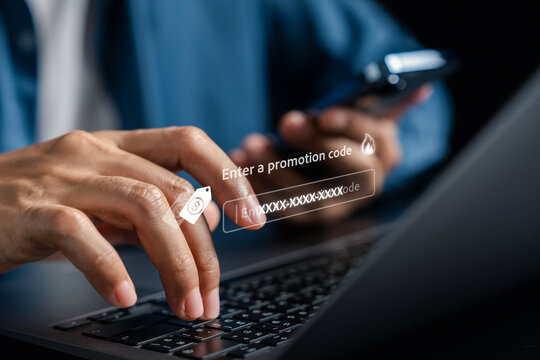 Promotion code and online discount concept. Person typing on laptop to enter code with price tag.