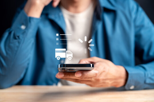 Delivery tracking status and online shopping concept. Man using smartphone to check shipping and logistics process.