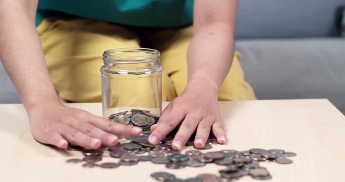 A person organizes and counts coins showcasing steps for effective personal finance management.