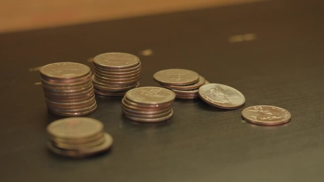 Extreme close up shot of American Quarters in various sized stacks.