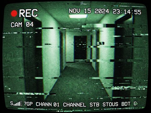 Surveillance footage of an empty hallway. The image has a green, grainy texture, suggesting a security camera feed. The date and time are displayed, along with a REC indicator, implying recording
