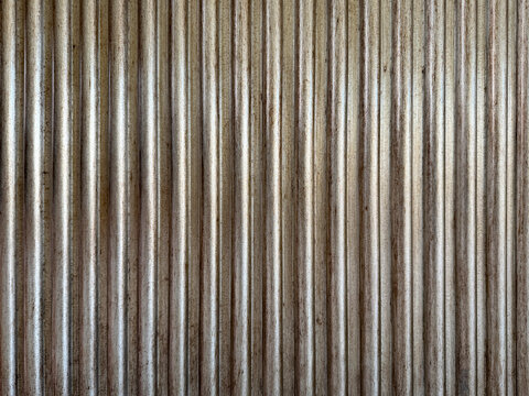 Natural bronze silver metal plate fluted panel or metal cladding slats. Beautiful elegant and luxurious corrugated metallic matte brass gold color paint. Seamless background texture.