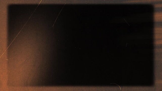 Vintage film frame with warm light leaks. Transparent Apple ProRes 4444 overlay with amber glow and organic scratches for cinematic VFX, compositing, and motion graphics.