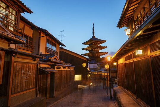 Yasaka dori historic street in the old town with traditional Japanese houses, five-story Yasaka Pagoda of the Buddhist Hōkanji Temple at the back, evening mood, blue hour, Higashiyama, Kyoto, Japan