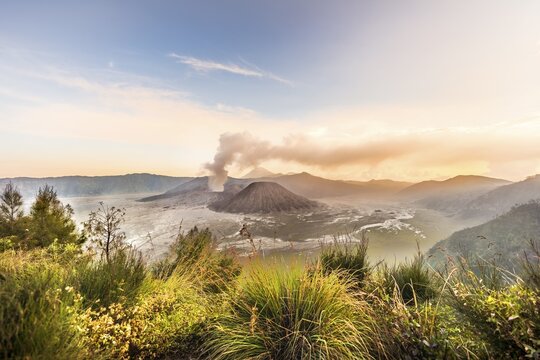 Sunrise, smoking volcano, Gunung Bromo, Mount Batok, Mount Kursi, Mount Semeru, Bromo Tengger Semeru National Park, Java, Indonesia
