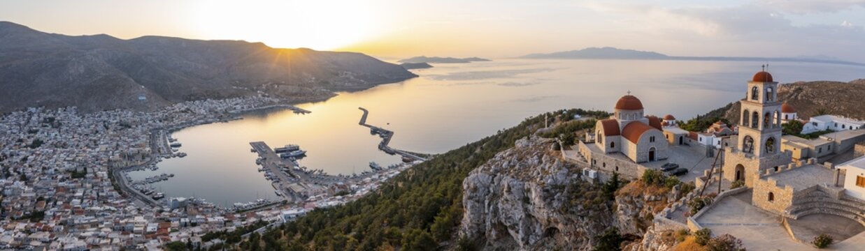 Sunrise, greek-orthodox monastery Saint Savvas, town view of Kalymnos, harbour and sea, Kalymnos, Dodecanese, Greece