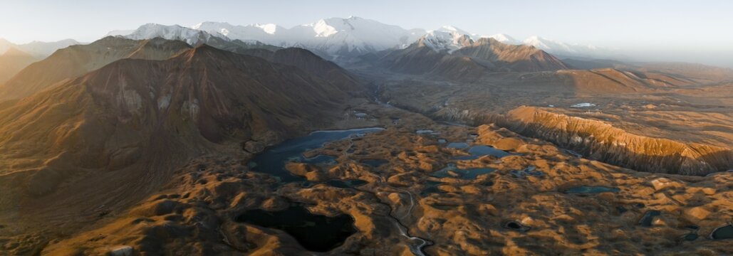 Aerial view, high mountain landscape with glacial moraines and mountain lakes, behind Pik Lenin, Trans Alay Mountains, Pamir Mountains, Osher Province, Kyrgyzstan