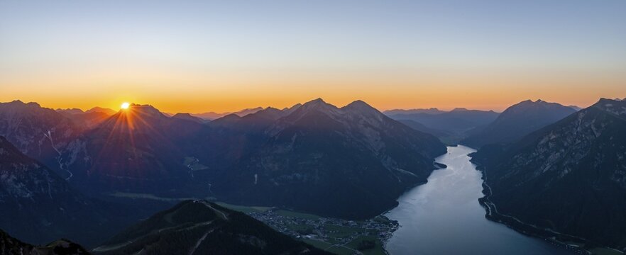 Last rays of sun over mountain landscape at sunset, view from summit of B&auml;renkopf to Achensee and summits Seebergspitze and Seekarspitze, panorama, Tyrol, Austria