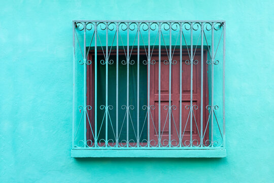 Colonial style window with mint green facade, Flores, Guatemala.