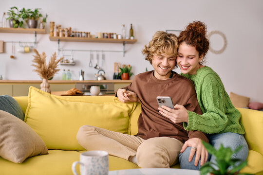 Curly young couple enjoying a cozy moment in their modern apartment