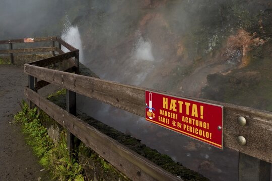 Warning sign on a fence, hot spring Deildartunguhver, highest-flow hot spring of Iceland with 180 liters of boiling water per second, Reykholtsdalur, Iceland