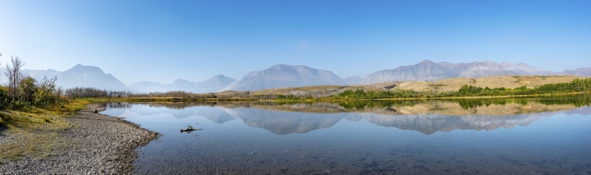 Mountains reflected in the lake, Maskinonge Lake, Waterton Lakes National Park, Alberta, Canada