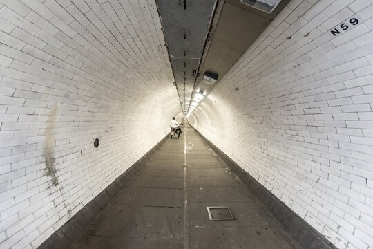Pedestrian tunnel with white tiles, Greenwich, London, England, Great Britain