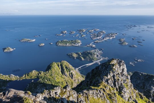 Houses on small rocky islands in the sea, view from the top of the mountain Festv&aring;gtind on Henningsv&aelig;r, V&aring;gan, Lofoten, Nordland, Norway