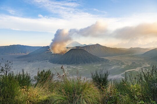 View of volcanoes at sunset, smoking volcano Gunung Bromo, Batok, Mt. Kursi, Gunung Semeru, National Park Bromo-Tengger-Semeru, Java, Indonesia