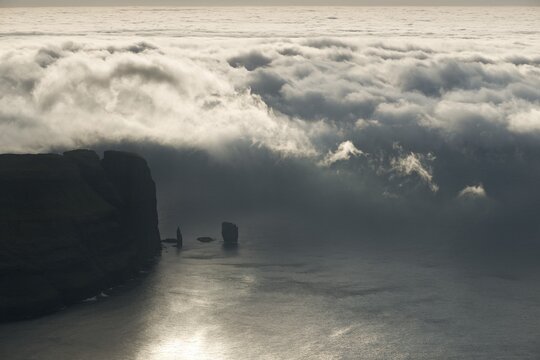 Kollur Mountain and the sea stacks of Risin and Kellingin in the evening light, Ei&eth;i, Eysturoy, Faroe Islands, Denmark