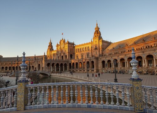 Bridge over canal, railing with painted azulejo tiles, Plaza de Espa&ntilde;a in the evening light, sunset, Sevilla, Andalusia, Spain