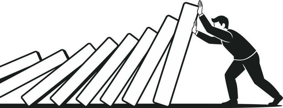 Businessman stopping falling dominoes to prevent chain reaction and business crisis