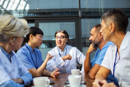 Doctors and nurses meeting at hospital cafeteria