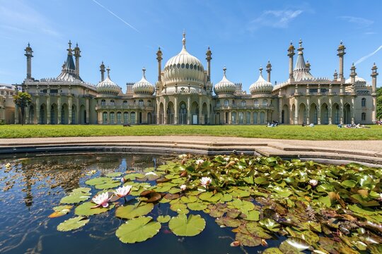 Royal Pavilion palace reflected with a pond with water lilies, Brighton, East Sussex, England, United Kingdom