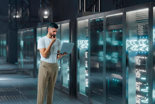 3D server analysis laptop with technician in secure data hall