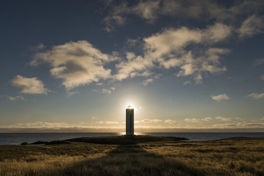 Lighthouse in the backlight, K&aacute;lfshamarsv&iacute;k, peninsula Skagi, Iceland