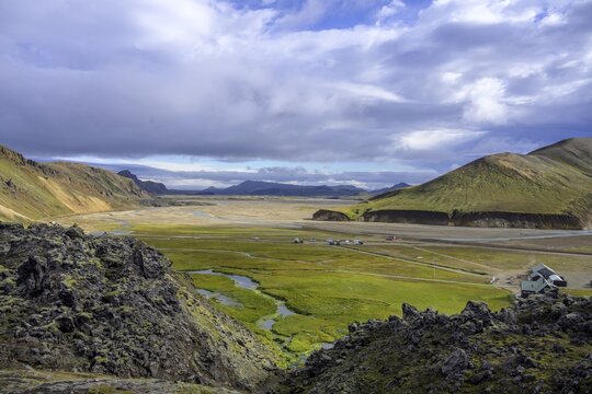 Mountain hut and empty campsite in the foreground Laugahraun lava field, Landmannalaugar, Su&eth;urland, Iceland