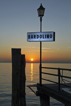 Landing stage, sunset, Bardolino, Lake Garda, Italy
