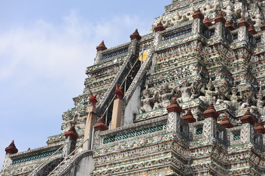 Intricate Architectural Details and Sculptural Figures on the Central Prang of Wat Arun (Temple of Dawn) on May 2 2026 in Bangkok, Thailand.	