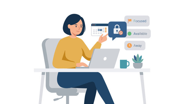 Female designer working on a laptop at a desk.