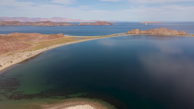 View aerial shots of La Gringa in Bahia De Los Angeles featuring campsites along the Sea of Cortez during a clear day.