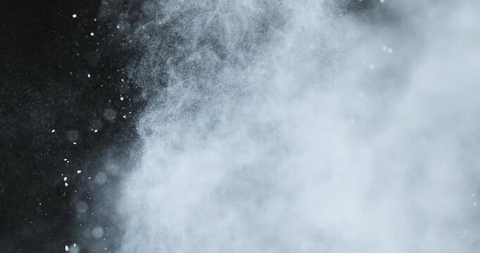 Fine powder dust exploding into soft airborne particles in slow motion, creating a smooth, dreamy texture. Ideal for backgrounds, overlays, and creative visual effects