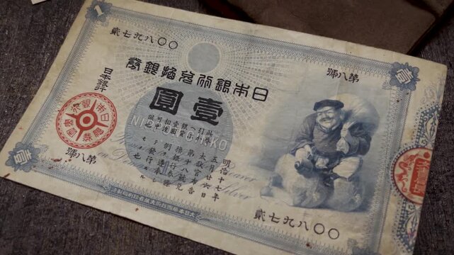 Macro Video of Antique Japanese 1 Yen Banknote Collection on Wooden Surface