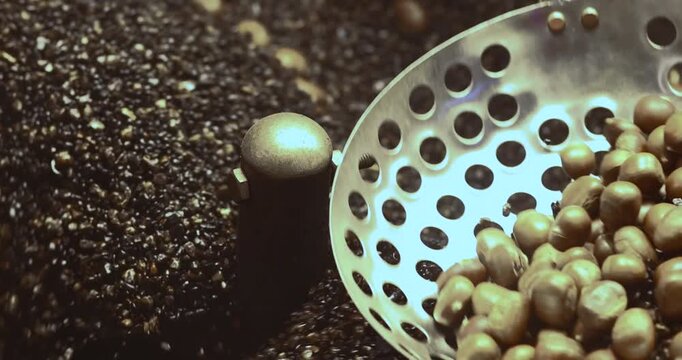 Roasting chestnuts in a hot pan, rolling and heating. Ideal for food, snack, street food, and cozy winter concepts