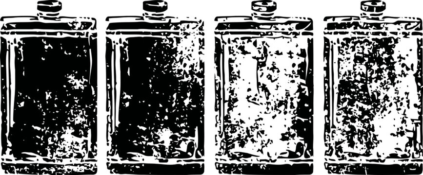 Four vintage metal hip flasks with textured worn surfaces lined in a row isolated on white